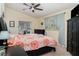 Bedroom featuring a decorative ceiling fan, patterned curtains, and neutral paint at 9007 63Rd Avenue E Dr, Bradenton, FL 34202