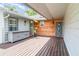 Charming porch area with wood accents, a built-in cabinet, and welcoming entrance at 9007 63Rd Avenue E Dr, Bradenton, FL 34202