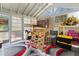 Sunroom with climbing equipment, rug, and windows at 9007 63Rd Avenue E Dr, Bradenton, FL 34202