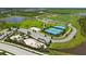 Aerial view of the community park featuring tennis courts, basketball court, sand volleyball, and green spaces at 10254 Morning Mist Ln, Sarasota, FL 34241