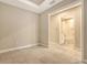 Bedroom featuring tile floors and an ensuite bathroom at 10254 Morning Mist Ln, Sarasota, FL 34241