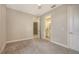 This bedroom has neutral walls, carpet floors, and a view to the bathroom at 10254 Morning Mist Ln, Sarasota, FL 34241