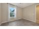 Bedroom featuring neutral carpet, window with sheer curtains, and ample natural light at 10254 Morning Mist Ln, Sarasota, FL 34241