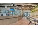 Chic cafe with modern lighting, stylish seating, and greenery offers a social gathering space at 10254 Morning Mist Ln, Sarasota, FL 34241