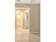 Hallway featuring tile floors and access to bathroom and other rooms at 10254 Morning Mist Ln, Sarasota, FL 34241