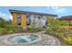 Relaxing hot tub surrounded by lush landscaping and a paved patio, providing a private spa experience at 10254 Morning Mist Ln, Sarasota, FL 34241