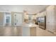 Spacious kitchen boasts white cabinets, stainless appliances and breakfast bar at 10254 Morning Mist Ln, Sarasota, FL 34241