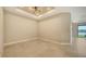 Empty Living Room boasts tile floor and recessed lights at 10254 Morning Mist Ln, Sarasota, FL 34241