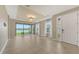 The living room features tile flooring, lake view, and access to the backyard at 10254 Morning Mist Ln, Sarasota, FL 34241