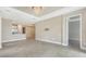 Open concept living room and kitchen area, with tile flooring and modern light fixture at 10254 Morning Mist Ln, Sarasota, FL 34241