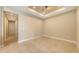 Well-lit living room featuring decorative ceiling trim and recessed lighting at 10254 Morning Mist Ln, Sarasota, FL 34241