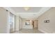 Open-concept living area with tile flooring and modern light fixture, connecting to the kitchen at 10254 Morning Mist Ln, Sarasota, FL 34241