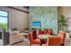 Comfortable lounge area with fireplace, seating, and views of the outdoors at 10254 Morning Mist Ln, Sarasota, FL 34241