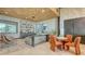 Stylish lounge featuring comfortable seating, a bookshelf, and natural light at 10254 Morning Mist Ln, Sarasota, FL 34241