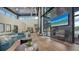Modern clubhouse lounge featuring plush seating, a fireplace, and floor-to-ceiling windows at 10254 Morning Mist Ln, Sarasota, FL 34241