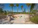 Outdoor play area featuring a sand pit enclosed by a brick wall with colorful building blocks at 10254 Morning Mist Ln, Sarasota, FL 34241