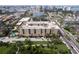 An aerial view of the condo building in a developed area with a pool at 1064 N Tamiami Trl # 1125, Sarasota, FL 34236