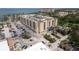 An aerial view of the condo complex near the bay with multiple buildings at 1064 N Tamiami Trl # 1125, Sarasota, FL 34236