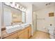 Modern bathroom with double sinks, granite countertop, and a glass-enclosed shower, offering a luxurious feel at 1064 N Tamiami Trl # 1125, Sarasota, FL 34236
