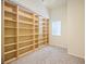 Bedroom with custom built-in bookcase and large window providing natural light, perfect for relaxation at 1064 N Tamiami Trl # 1125, Sarasota, FL 34236