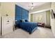 Stylish bedroom features a tufted blue headboard, a leather couch and carpeted floors at 1064 N Tamiami Trl # 1125, Sarasota, FL 34236