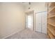 Carpeted bedroom with closet, and adjacent room, providing ample storage, and living space at 1064 N Tamiami Trl # 1125, Sarasota, FL 34236