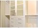 Organized closet featuring built-in drawers, shelves, and frosted glass cabinets, providing ample storage space at 1064 N Tamiami Trl # 1125, Sarasota, FL 34236