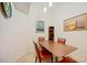 The dining room features a wooden table with seating for four at 1064 N Tamiami Trl # 1125, Sarasota, FL 34236