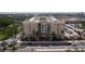 A street view of the condo building with a landscaped median strip at 1064 N Tamiami Trl # 1125, Sarasota, FL 34236