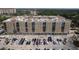 Beautiful multi-story condo building with blue awnings and a parking lot at 1064 N Tamiami Trl # 1125, Sarasota, FL 34236
