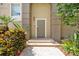 Inviting home entrance with a neutral-colored door and lush landscaping at 1064 N Tamiami Trl # 1125, Sarasota, FL 34236
