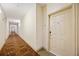 Hallway with neutral paint, patterned carpet, and a door to an apartment at 1064 N Tamiami Trl # 1125, Sarasota, FL 34236