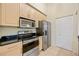 The kitchen features stainless steel appliances and plenty of cabinet space at 1064 N Tamiami Trl # 1125, Sarasota, FL 34236