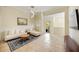 Bright and airy living room with tile flooring, and a comfortable seating area with access to the balcony at 1064 N Tamiami Trl # 1125, Sarasota, FL 34236