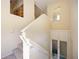 Carpeted staircase with white banister and built-in storage at 1064 N Tamiami Trl # 1125, Sarasota, FL 34236