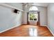 Bedroom with vaulted ceiling, hardwood floors, large window, and modern decor at 1112 Golfview Woods Dr # 1112, Sun City Center, FL 33573