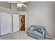 Bedroom features tile floors, a day bed, ceiling fan, and access to bathroom at 1112 Golfview Woods Dr # 1112, Sun City Center, FL 33573