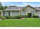 Well-maintained home with manicured lawn and garden at 1112 Golfview Woods Dr # 1112, Sun City Center, FL 33573