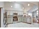 Open kitchen with stainless steel appliances, white cabinets, and granite countertops at 1112 Golfview Woods Dr # 1112, Sun City Center, FL 33573