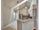 Bright kitchen features granite countertops, stainless steel appliances, and ample counter space at 1112 Golfview Woods Dr # 1112, Sun City Center, FL 33573