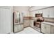 Modern kitchen with stainless steel appliances and sleek, granite countertops at 1112 Golfview Woods Dr # 1112, Sun City Center, FL 33573