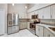 Modern kitchen featuring stainless steel appliances, granite countertops, and ample cabinet space at 1112 Golfview Woods Dr # 1112, Sun City Center, FL 33573