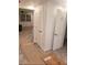 Entryway with white doors, trim, and new flooring at 11707 104Th St, Largo, FL 33773