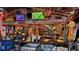 Eclectic bar with multiple TVs and decor, creating a unique entertainment space at 1240 Solitude Ln, Sarasota, FL 34242