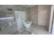 Spa-like bathroom with a standalone tub, a frameless glass shower, and marble accents at 1240 Solitude Ln, Sarasota, FL 34242