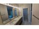 Luxurious bathroom featuring double sinks, a marble countertop, and a glass-enclosed shower at 1240 Solitude Ln, Sarasota, FL 34242