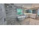 Spa-like bathroom with a freestanding tub, walk-in shower, and dual vanity sinks at 1240 Solitude Ln, Sarasota, FL 34242