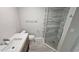 Modern bathroom featuring a glass shower, a stylish vanity with a white countertop, and neutral color palette at 1240 Solitude Ln, Sarasota, FL 34242