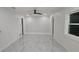 Spacious bedroom with sleek floors, features ample natural light and an expansive layout at 1240 Solitude Ln, Sarasota, FL 34242