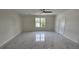 Spacious bedroom featuring sleek marble floors, abundant natural light, and ample closet space at 1240 Solitude Ln, Sarasota, FL 34242